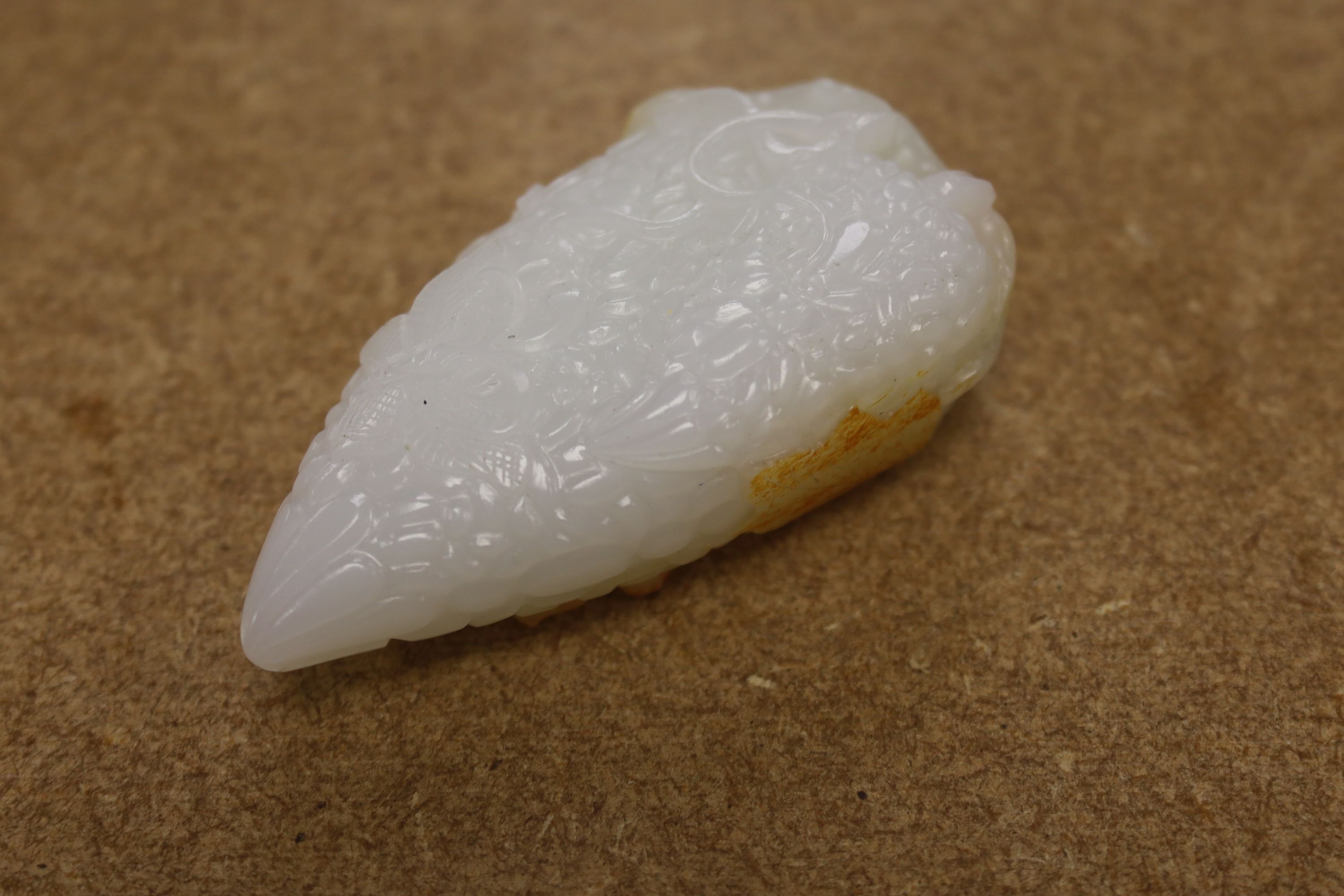 A Chinese white and russet skin jade carving, 7cm high